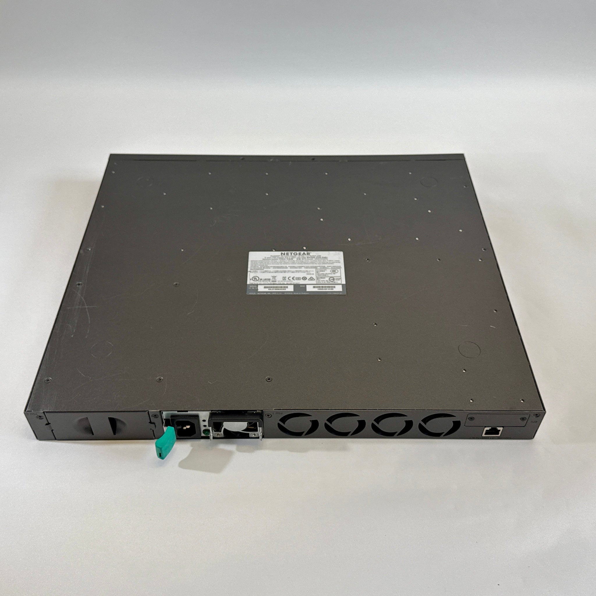 Netgear M4300-52G-PoE+ 48 port Layer 3 managed gigabit ethernet switch GSM4352PS with 1000W PSU bottom view label