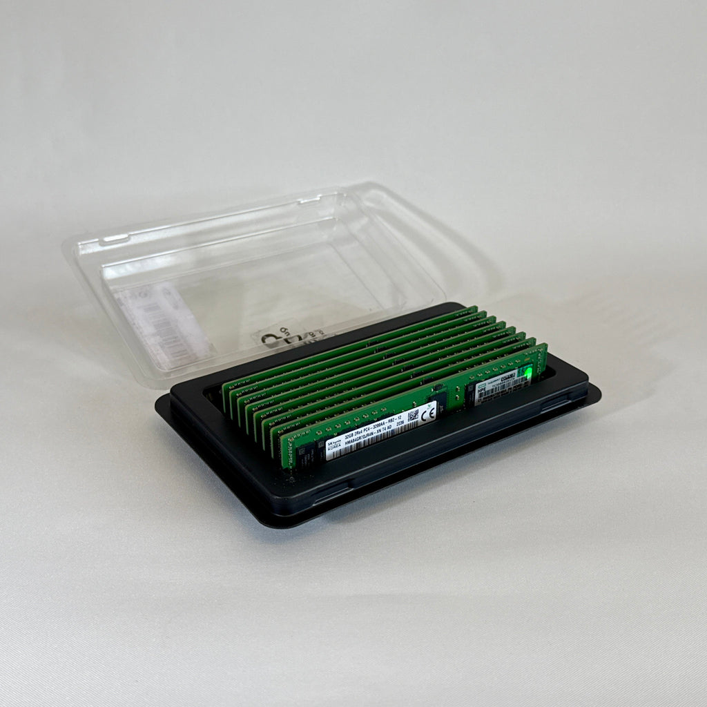 Front view of an SK Hynix 32GB 2Rx4 PC4-32AA DDR4 Registered ECC server memory stick. The green PCB holds the black memory chips and a clear white manufacturer label displaying the part number HMA84GR7DJR4N-XN and specifications.